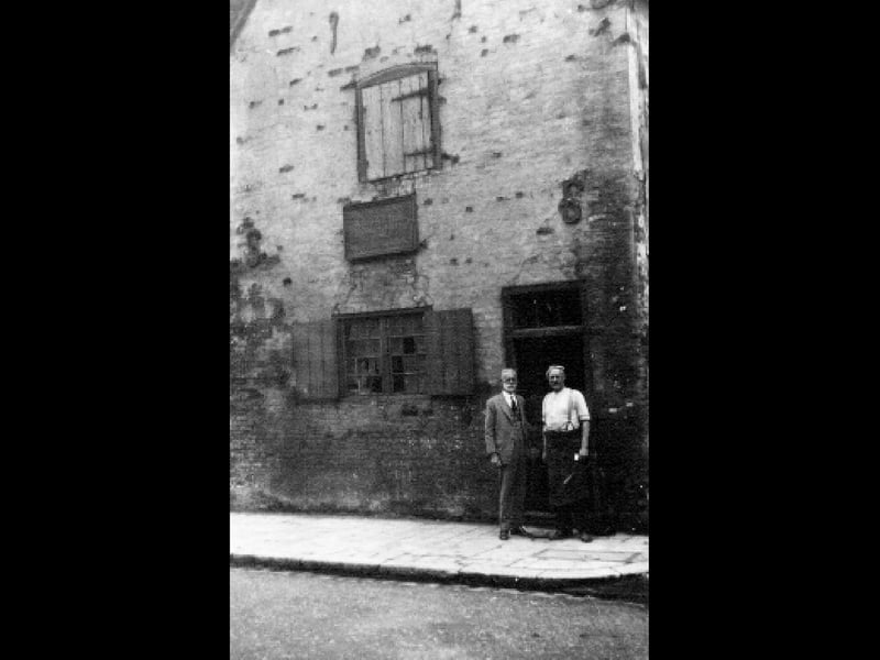 Alfred Baxter (right) in 1926 outside the blacksmiths shop in Old Portsmouth.