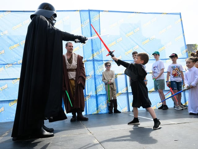 A light saber fight with Darth Vader. Picture: Keith Woodland (110521-79)