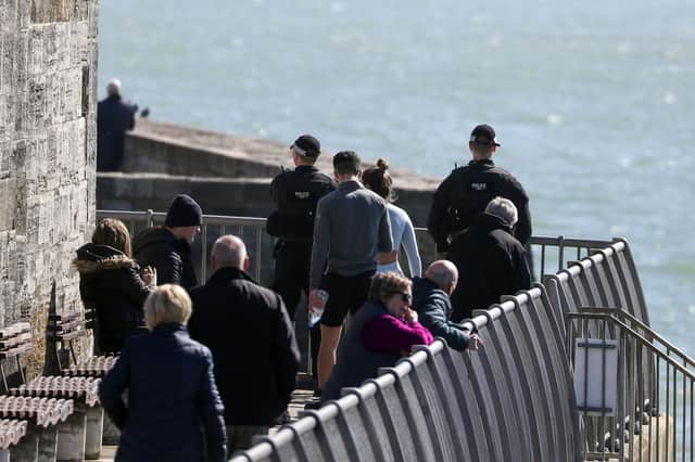 Police officers patrol in Old Portsmouth after Prime Minister Boris Johnson has put the UK in lockdown to help curb the spread of the coronavirus. Picture: Steve Parsons/PA Wire