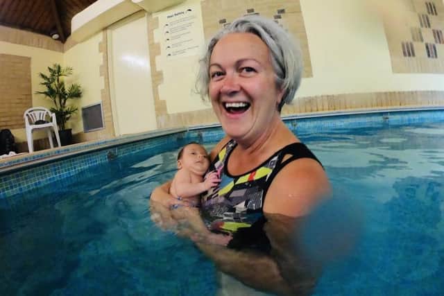 Endurance swimmer and suicide campaigner Anna Wardley, from Alverstoke, has had some of her writing featured in an anthology of work by women who gave birth in lockdown. Pictured: Anna taking Grace for her first swim at six weeks old