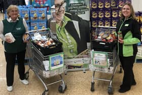 Waterlooville Food Bank volunteer Deborah Dark with ASDA Waterlooville community champion Jacqui Benham and donations of food