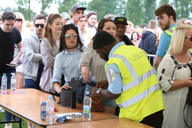 A security guard checks a bag at Cosham's former Mutiny festival.