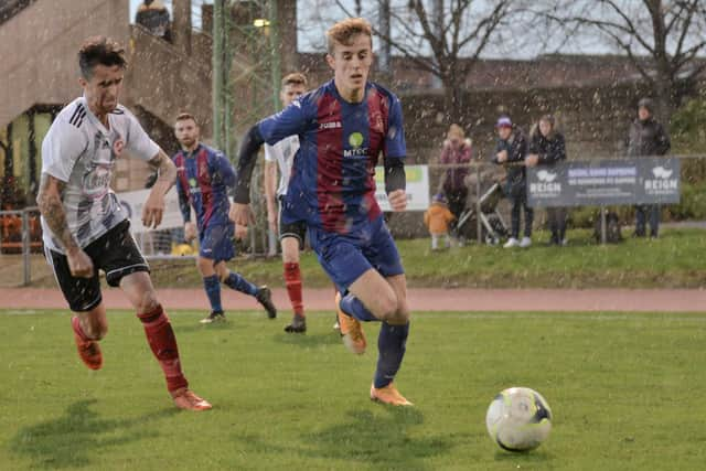 James Franklyn, right, during a first half downpour against Millbrook. Pic: Martyn White.