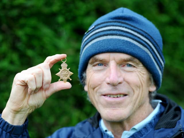 Mark Williams, 71, from Waterlooville, with the WW1 medal he discovered in his back garden.

Picture: Sarah Standing