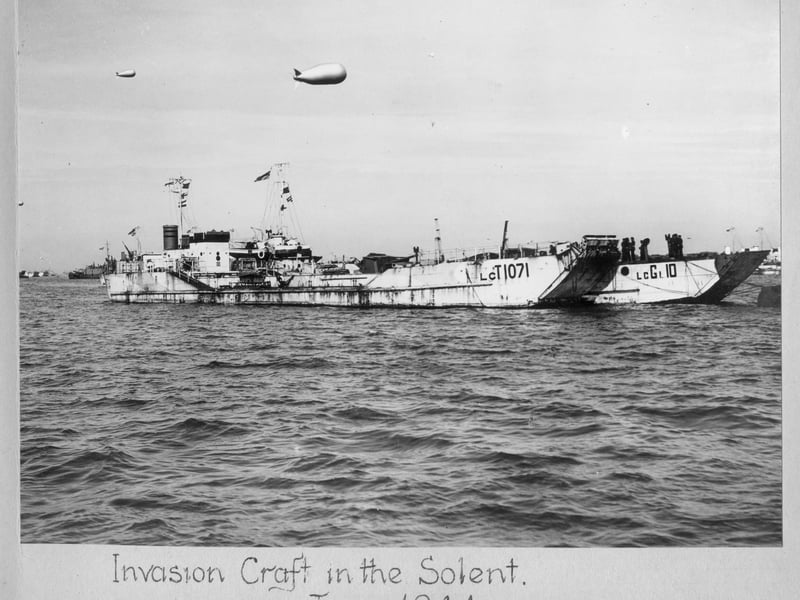 LCT 1071, and behind it LCG(L) 10 - a Landing Craft, Gun (Large) - moored in the Solent around the time of D-Day. More ships and landing craft can be seen behind. Local people often said it looked like you could walk to the Isle of Wight by going from ship to ship.