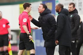 Derek Adams is shown a yellow card for arguing with the referee - after claiming Gareth Evans should have been sent off during Pompey's 1-1 draw at Plymouth in 2019. Picture: Joe Pepler