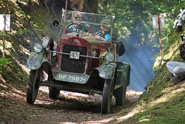 John Wilton and his car in action.