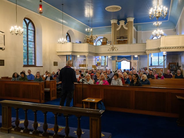 A number of people turned up to take the tour of the Haslar site. Mark Trasler of the Haslar Heritage Group address the visitors at St Luke's church. Picture: Keith Woodland (070921-1)