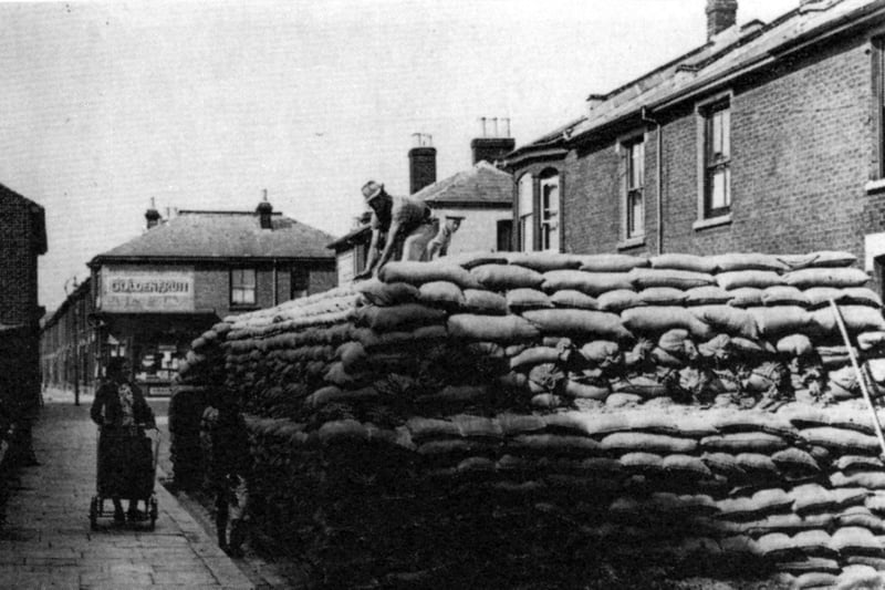 Sandbagged watertank in Milford Road, Landport during the war.