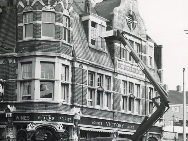 Christmas decorations being installed in Commercial Road, Portsmouth in 1956.Picture: Wright & Logan Photographers