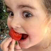 Winner of One Summer's Day 2018: Kate Misselbrook's goddaughter eating strawberries in the park. Picture: Kate Misselbrook