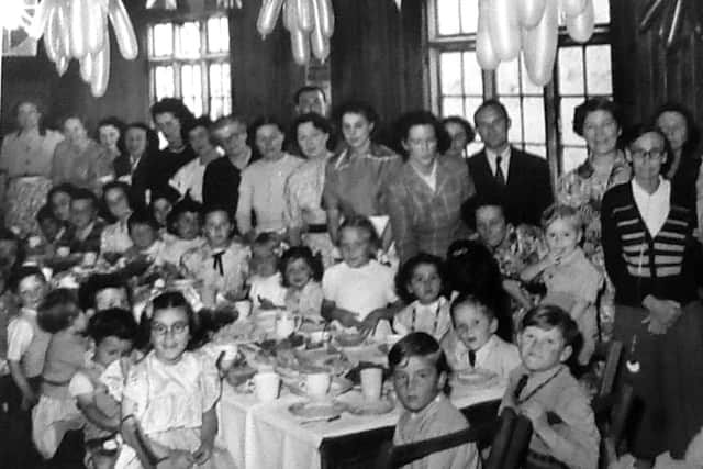 Children and parents in the hall, Christmas 1951.