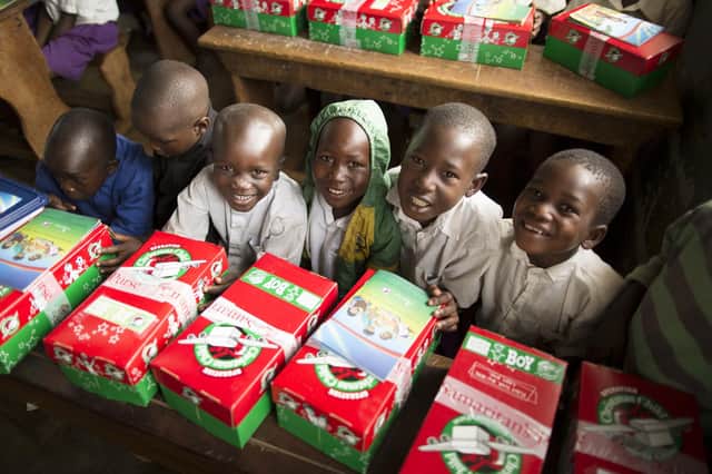 Children in Uganda receive their Christmas presents, kindly donated through the Operation Christmas Child appeal.