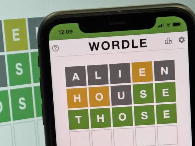 A mobile phone shows the screen of the popular online game Wordle. Picture: Nick Ansell/PA Wire