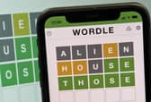 A mobile phone shows the screen of the popular online game Wordle. Picture: Nick Ansell/PA Wire