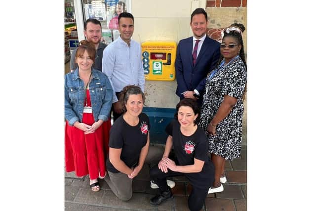 Saving Lives Together and Lalys Pharmacy partnered up to install a new defibrillator in Guildhall Walk

Pictured: STOOD: Councillors Kirsty Mellor and Carl Corkery for Charles Dickens Ward in Portsmouth, Director of Lalys Pharmacy Dr Raj Laly, Stephen Morgan MP for Portsmouth South, and Councillor Yinka Adeniran for Charles Dickens Ward.
KNELT: Founder of Saving Lives Together, Aisa Fraser with colleague and nurse, Ellie Batchelor