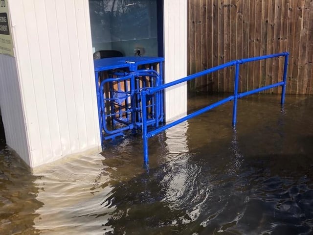 The flooded football ground.