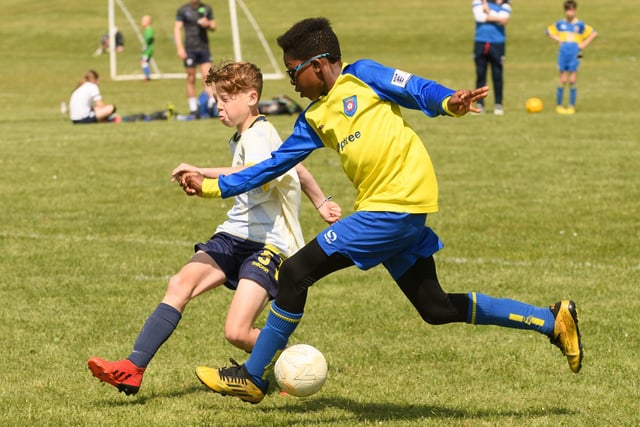 Action from the Clanfield youth football tournament at Horndean Technology College. Picture: Keith Woodland (270521-404)