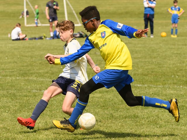 Action from the Clanfield youth football tournament at Horndean Technology College. Picture: Keith Woodland (270521-404)