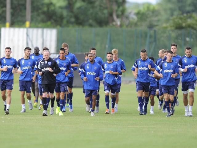 Coach Alan McLoughlin puts Pompey's players through their paces on the first ay of pre-season training at St John's College playing fields in July 2013. Picture: Allan Hutchings