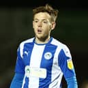 George Johnston of Wigan Athletic in action during the Sky Bet League One match between Northampton Town and Wigan Athletic at PTS Academy Stadium on February 09, 2021 in Northampton, England. (Photo by Pete Norton/Getty Images)