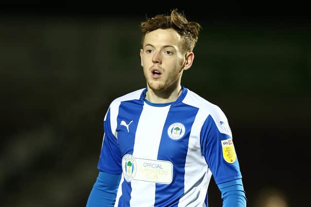 George Johnston of Wigan Athletic in action during the Sky Bet League One match between Northampton Town and Wigan Athletic at PTS Academy Stadium on February 09, 2021 in Northampton, England. (Photo by Pete Norton/Getty Images)