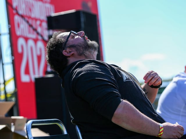 A chilli eating contestant starts to feel the heat of the competition.