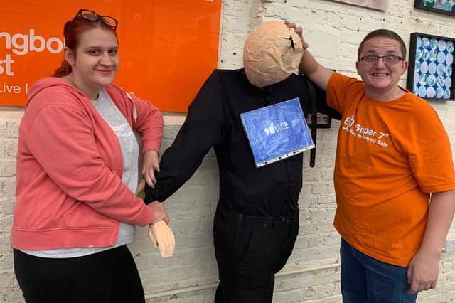 Make is holding its first ever urban scarecrow festival to honour key workers in Portsmouth. Pictured: Molly Bailey and Daniel Donovan, who are training in retail and catering with Make, with a scarecrow designed to thank police officers