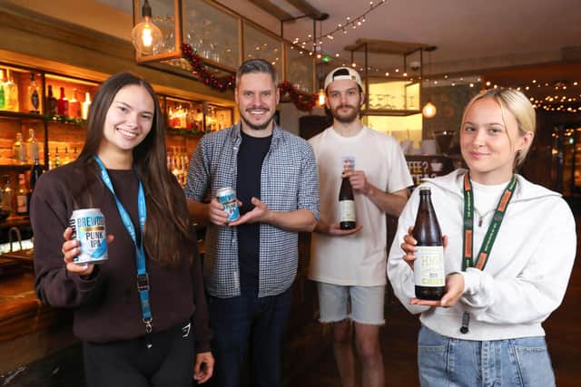 From left, Amy Ralf, manager Chirs Vaux, Joe Stewart and Livy Elson with low alcohol or non-alcoholic drinks for Dry January at the Southsea Village pub, Palmerston Road, Southsea  
Picture: Chris Moorhouse (jpns 311222-27)
