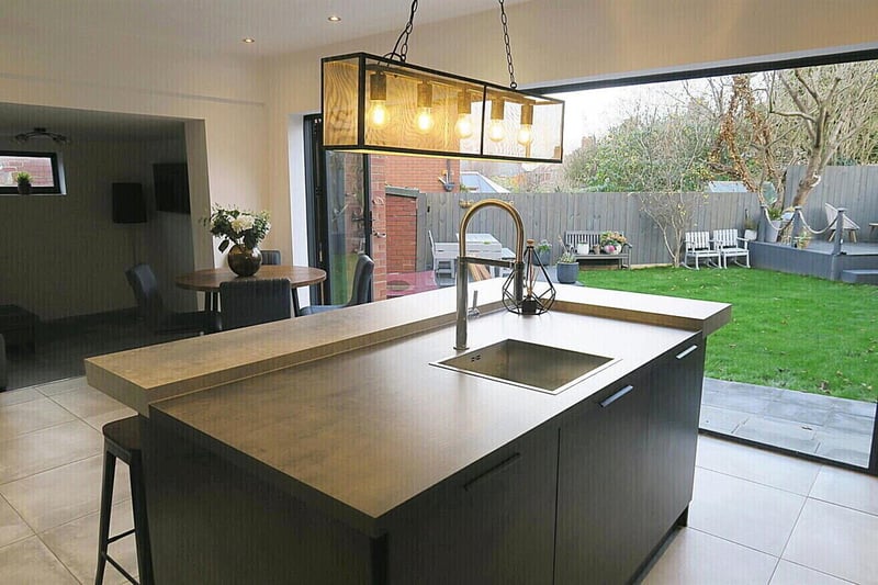 Bi-fold doors in the stylish kitchen for easy access to the rear garden.