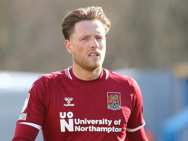 Club: Northampton; Age: 25; 2021-22 league appearances: 39; Goals: 8; Clean sheets: 18; Previous clubs: Macclesfield, Kidderminster