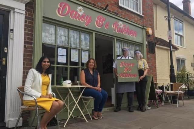 Fareham MP Suella Braverman, left, pictured visiting Daisy B’s Kitchen in Titchfield