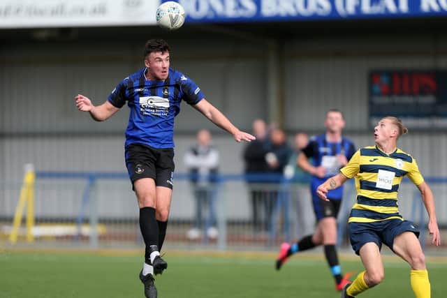 Clanfield defender Simon Ashling, left, is watched by Grove's Zak Willet. Picture: Chris Moorhouse