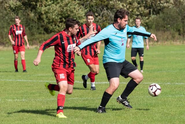 Burrfields (blue) in Mid-Solent League action for Burrfields at Horndean United in 2019/20. Picture: Duncan Shepherd