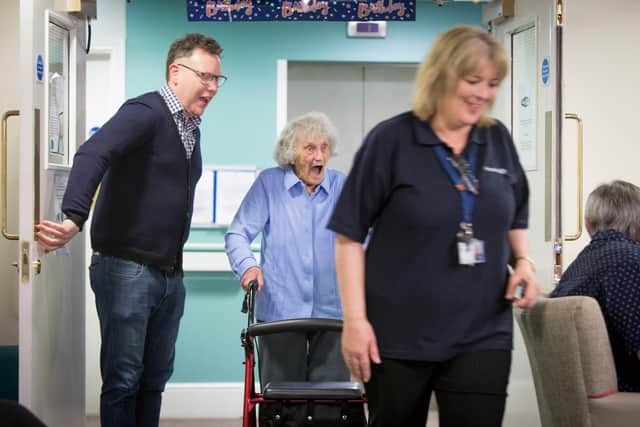Doris Cleife with her grandson, David Bowen, is surprised to see her all her friends waiting for her in the lounge of Brunel Court.

Picture: Habibur Rahman