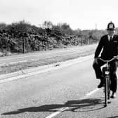 A policeman riding his bike down a street in Gosport on April 15, 1989 PP3873