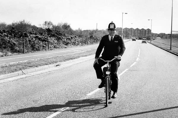 A policeman riding his bike down a street in Gosport on April 15, 1989 PP3873