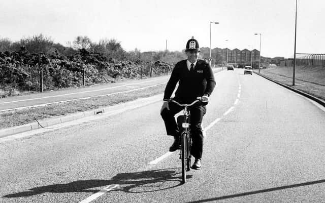 A policeman riding his bike down a street in Gosport on April 15, 1989 PP3873