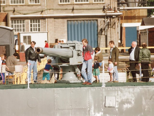 Visitors onboard the M33 monitor HMS Minerva taking a look at the veteran craft moored in a basin at Portsmouth Navy Days in 1992. Picture: (2309-5)