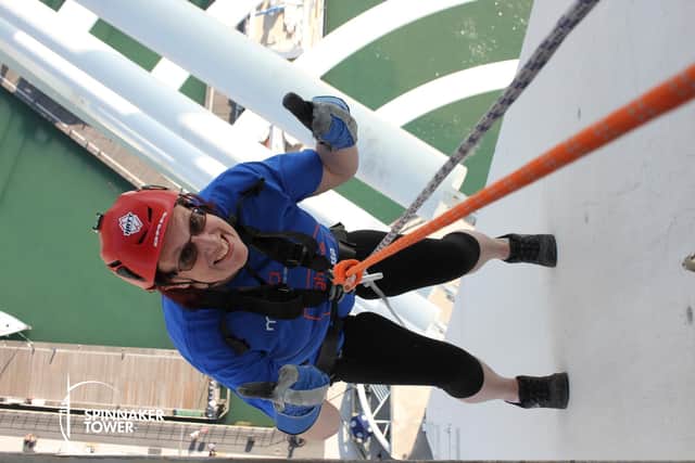 Caryl Purdy completing her abseil