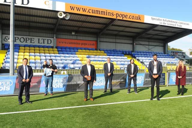 Hawks officially unveil their new 3G pitch at the newly-named Draper Tools Community Stadium. From left - Alan Mak (MP for Havant), Joe Drape (Draper Tools director, with his son Leo), Derek Pope (Hawks chairman), Graham Wade (Draper Tools MD), Tom Draper (Draper Tools, director), Prad Bains (Mayor of Havant) and Charlotte Chandler (Hawks commercial/marketing manager). Picture: Sarah Standing