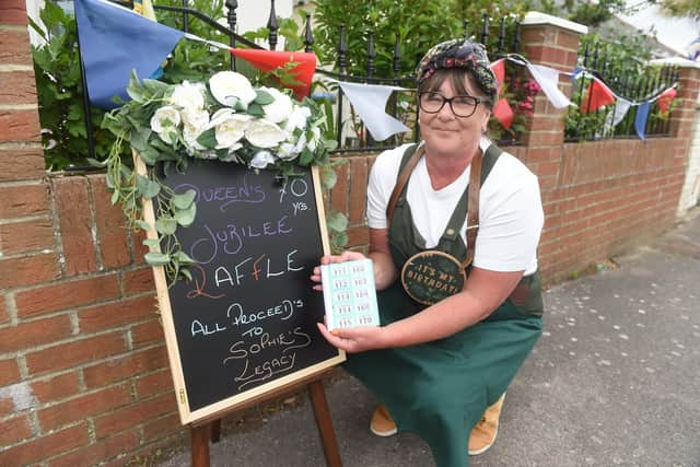 Organiser Annemarie Britton celebrating her 56th birthday at the street party. All proceeds from the raffle are going to Sophie's Legacy
Picture: Sarah Standing (050622-9611)