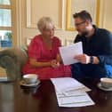 Alex Shrimpton, who runs UtilityMOT. Alex Shrimpton, who runs UtilityMOT, showing customer Rebecca Simmons which part of her bills she could be saving money on. Picture: Hope McKellor.