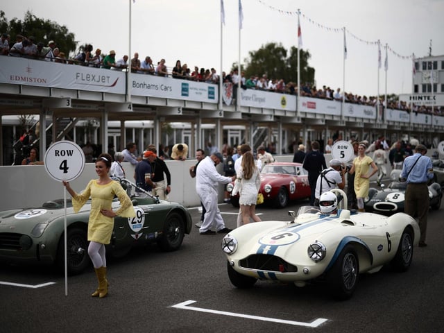 Classic race cars get ready for a race on the opening day of the Goodwood Revival meeting 2023, north of Chichester in southern England on September 8, 2023. The only historic motor race meeting to be staged entirely in a period theme, Goodwood Revival is an immersive celebration of iconic cars and fashion.