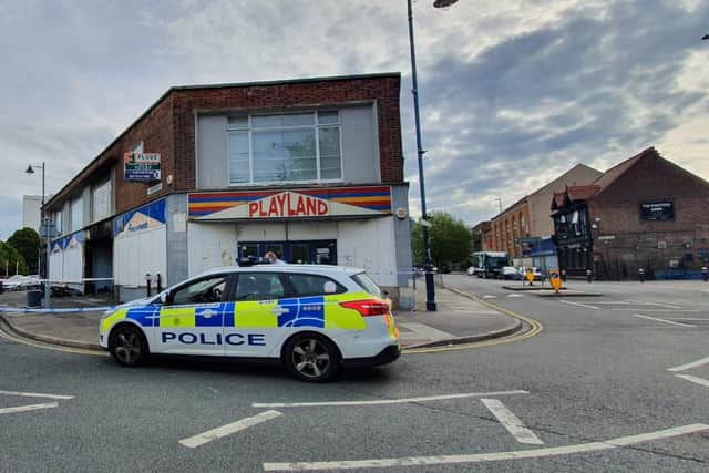 Police remain at the scene of the fire in Commercial Road, Portsmouth. Picture: Habibur Rahman