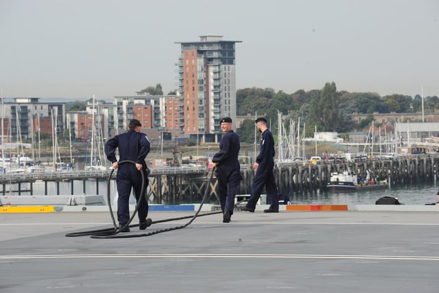 Sailors working on the HMS Queen Elizabeth flight deck.