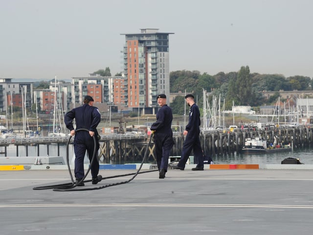 Sailors working on the HMS Queen Elizabeth flight deck.