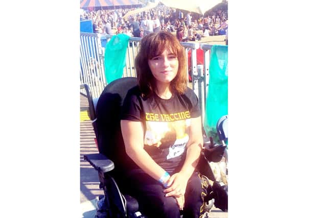 Faith Martin from Portsmouth has launched a campaign called Commit To Access, which encourages music artists to make shows more accessible for disabled music fans. Pictured: Faith Martin, 19, at a festival