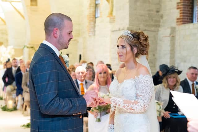 Amy and Craig Hughes exchanging their vows.
Picture: Carla Mortimer Wedding Photography