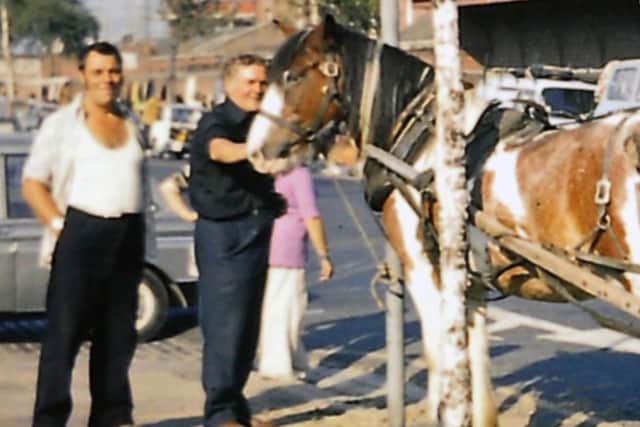 Two Unicorn Road market traders with their horse.